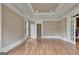 Empty living room with hardwood floors, neutral walls and detailed trim work at 115 Robinwood Ct, Fayetteville, GA 30214