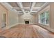 Spacious living room with coffered ceiling, fireplace, and hardwood floors at 115 Robinwood Ct, Fayetteville, GA 30214