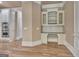 A built-in office space with white cabinets and granite countertops at 115 Robinwood Ct, Fayetteville, GA 30214