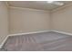 This room features neutral carpeting and paint, and a recessed ceiling light at 115 Robinwood Ct, Fayetteville, GA 30214