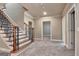 This stairway features hardwood steps, wrought iron railings, and neutral carpet at 115 Robinwood Ct, Fayetteville, GA 30214