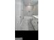 Bathroom with marble tile flooring, modern vanity and bathtub with shower at 5425 Herndon Blvd, Morrow, GA 30260