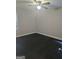 Spacious bedroom with dark wood flooring, ceiling fan, and plenty of natural light at 5425 Herndon Blvd, Morrow, GA 30260