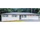 Charming single-story home with freshly painted white brick exterior and attached carport at 5425 Herndon Blvd, Morrow, GA 30260
