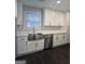 Bright kitchen with white cabinetry, quartz countertops, and stainless steel appliances at 5425 Herndon Blvd, Morrow, GA 30260