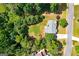 Aerial view of a home with a well-manicured lawn and surrounding trees at 1120 Bagwell Dr, Kennesaw, GA 30152