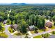 Aerial view of a home surrounded by lush trees in a beautiful neighborhood at 1120 Bagwell Dr, Kennesaw, GA 30152
