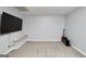 Large basement with plush carpeting, a flat screen television, and neutral paint for versatile use at 1120 Bagwell Dr, Kennesaw, GA 30152