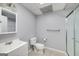 Compact bathroom featuring a single sink vanity, tile flooring, and a walk-in shower at 1120 Bagwell Dr, Kennesaw, GA 30152