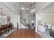 Open foyer leading to a staircase, dining room, and living room with hardwood floors at 1120 Bagwell Dr, Kennesaw, GA 30152
