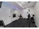 Home gym featuring gym equipment, rubber flooring, bright lighting, and a full-length mirror at 1120 Bagwell Dr, Kennesaw, GA 30152