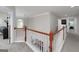 Bright upstairs hallway with views to the foyer below and access to bedrooms and a computer room at 1120 Bagwell Dr, Kennesaw, GA 30152