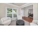 Comfortable living room showcasing neutral tones, a large window, and an open floor plan at 1120 Bagwell Dr, Kennesaw, GA 30152