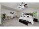 A grand main bedroom suite with sitting area, tray ceiling, and views to the backyard at 1120 Bagwell Dr, Kennesaw, GA 30152