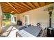Outdoor patio with exposed beams, table and chairs, a grill, and heater, perfect for gatherings at 1120 Bagwell Dr, Kennesaw, GA 30152