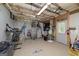 Unfinished basement space with exposed ceiling, sports equipment, and access to the outside at 1120 Bagwell Dr, Kennesaw, GA 30152