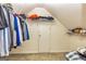 Finished attic storage space features low ceilings, useful shelving, and a doorway to another space at 306 Sandalin Ln, Peachtree City, GA 30269