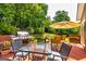 Outdoor back deck with a grill and seating for entertaining guests at 306 Sandalin Ln, Peachtree City, GA 30269