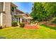 Inviting back deck area with outdoor seating, a grill, and access to the lush backyard, perfect for entertaining at 306 Sandalin Ln, Peachtree City, GA 30269