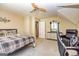 Spacious upper level bedroom with comfortable chair and view to another room in the home at 306 Sandalin Ln, Peachtree City, GA 30269
