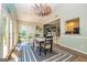 Dining area with views to the outdoor patio area and into the connected kitchen at 306 Sandalin Ln, Peachtree City, GA 30269
