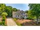 Charming home featuring a long driveway with tasteful landscaping and a classic facade at 306 Sandalin Ln, Peachtree City, GA 30269