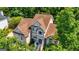 Stunning traditional-style home with a well-maintained brown roof and lush green landscaping at 306 Sandalin Ln, Peachtree City, GA 30269