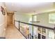 Bright second floor hallway overlooking the living room and filled with lots of natural light at 306 Sandalin Ln, Peachtree City, GA 30269