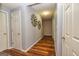 Hallway featuring doors and neutral paint with rustic metal star decor on the walls at 306 Sandalin Ln, Peachtree City, GA 30269