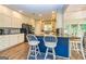 Modern kitchen with white cabinets, granite countertops, and stainless steel appliances at 306 Sandalin Ln, Peachtree City, GA 30269
