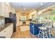 Bright kitchen boasts granite countertops, stainless steel appliances, and an open floorplan at 306 Sandalin Ln, Peachtree City, GA 30269