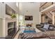 Inviting living room with a fireplace, hardwood floors, and an open concept design at 306 Sandalin Ln, Peachtree City, GA 30269