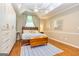 Main bedroom with hardwood floors, built-in closets, ceiling fan, and stylish decor at 306 Sandalin Ln, Peachtree City, GA 30269