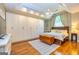 Spacious main bedroom features built-in closets, ceiling fan, and an exterior view at 306 Sandalin Ln, Peachtree City, GA 30269