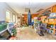 Unfinished storage space with boxes, shelves, and a door to the backyard at 306 Sandalin Ln, Peachtree City, GA 30269