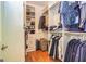 Spacious walk-in closet with shoe shelving and hanging storage at 306 Sandalin Ln, Peachtree City, GA 30269
