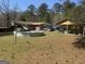 Extensive backyard with above ground pool and outbuildings, providing ample space for recreation and storage at 420 Dot Dr, South Fulton, GA 30349