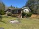 Brick home exterior with landscaped yard, highlighting its traditional design and suburban setting at 420 Dot Dr, South Fulton, GA 30349