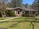 Charming single-story brick home featuring a well-maintained front yard and classic architectural details at 420 Dot Dr, South Fulton, GA 30349