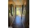 Inviting hallway with classic tile flooring and decorative mirrors leading towards the main living areas at 420 Dot Dr, South Fulton, GA 30349