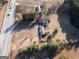 An aerial view of the property showing its location next to a street and across the street to a forest at 2353 Highway 155 N, Mcdonough, GA 30252