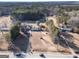 An aerial view of the property with beautiful surrounding of trees and a long road at 2353 Highway 155 N, Mcdonough, GA 30252