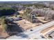 An aerial view of the property showcasing the houses, surrounded by trees and a large road at 2353 Highway 155 N, Mcdonough, GA 30252