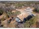 Aerial view of the property showcasing the land, buildings, and a Dollar General nearby Highway 155 at 2353 Highway 155 N, Mcdonough, GA 30252