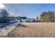 Aerial view of a one-story home with a detached garage, long driveway, and spacious yard at 2353 Highway 155 N, Mcdonough, GA 30252