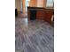 Kitchen features modern flooring, black dishwasher, and wooden cabinets at 7069 Littlebrook Way, Douglasville, GA 30134