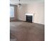 Living room with a cozy fireplace, neutral carpet and a ceiling fan at 7069 Littlebrook Way, Douglasville, GA 30134