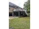 Backyard featuring a raised deck with stairs and a covered patio area at 2142 E Atlanta Rd, Stockbridge, GA 30281