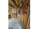 This basement has cement floors and exposed ceilings with wood framing to add stability to this home at 2142 E Atlanta Rd, Stockbridge, GA 30281