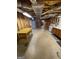 Unfinished basement with ductwork, concrete floor, storage and utility connections at 2142 E Atlanta Rd, Stockbridge, GA 30281
